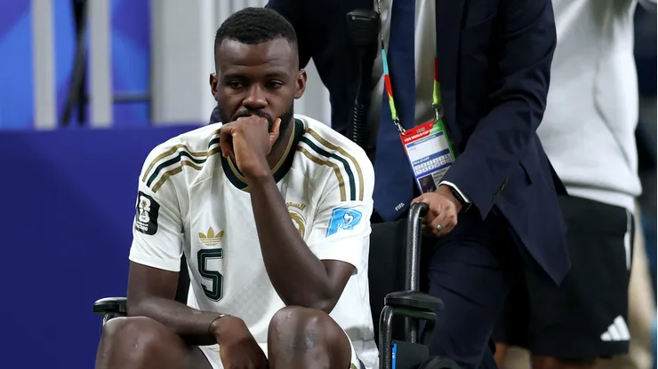 HOUSTON, TEXAS - JUNE 26: Hassan Al-Tambakti #5 of Saudi Arabia is taken off the pitch on a wheelchair at half time after sustaining an injury during the FIFA World Cup 2026 Group H match between Cabo Verde and Saudi Arabia at Houston Stadium on June 26, 2026 in Houston, Texas. (Photo by Michael Steele/Getty Images)