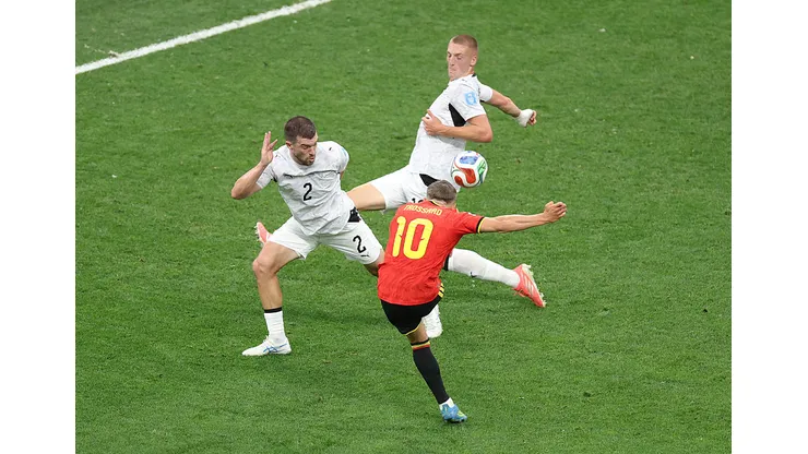 VANCOUVER, BRITISH COLUMBIA - JUNE 26: Leandro Trossard #10 of Belgium shoots hitting the arm of Finn Surman #16 of New Zealand, which goes to a VAR review during the FIFA World Cup 2026 Group G match between New Zealand and Belgium at BC Place Vancouver on June 26, 2026 in Vancouver, British Columbia. (Photo by Fran Santiago/Getty Images)