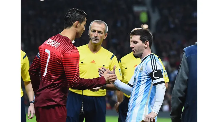 MANCHESTER, ENGLAND - NOVEMBER 18: Lionel Messi of Argentina shakes hands with Cristiano Ronaldo of Portugal prior to the International Friendly match between Argentina and Portugal at Old Trafford on November 18, 2014 in Manchester, England. (Photo by Laurence Griffiths/Getty Images)