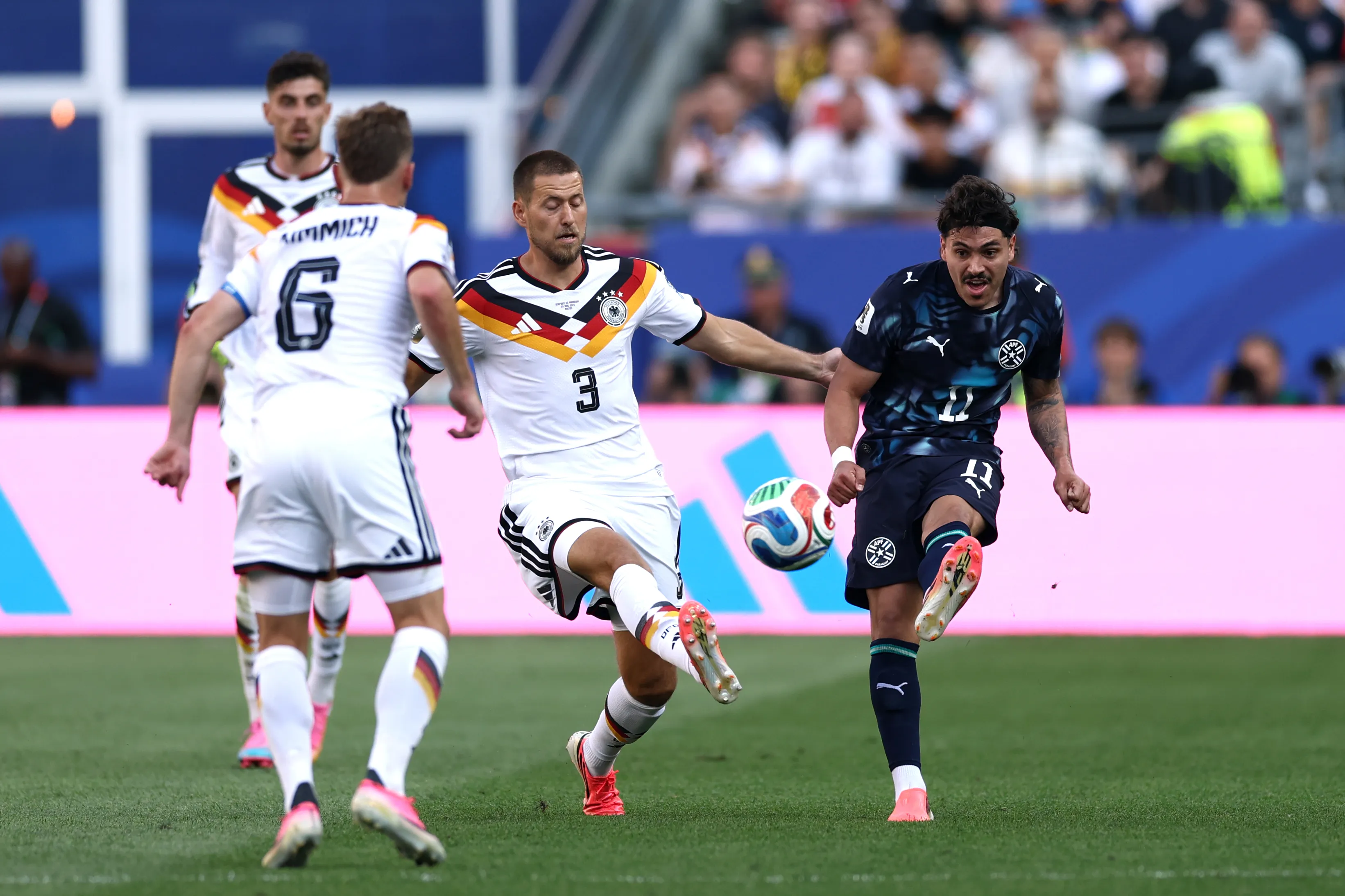 FOXBOROUGH, MASSACHUSETTS – JUNE 29: Mauricio #11 of Paraguay passes the ball against Waldemar Anton #3 of Germany during the FIFA World Cup 2026 Round Of 32 match between Germany and Paraguay at Boston Stadium on June 29, 2026 in Foxborough, Massachusetts. (Photo by Megan Briggs/Getty Images)