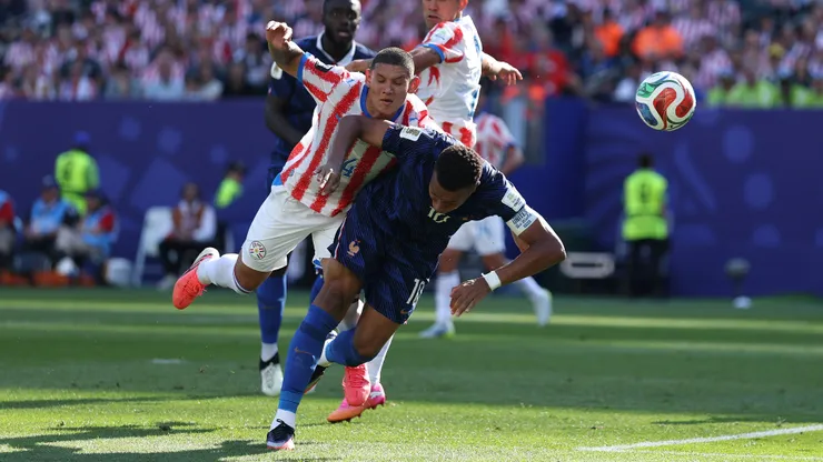 PHILADELPHIA, PENNSYLVANIA - JULY 04: Kylian Mbappe #10 of France and Juan Jose Caceres #4 of Paraguay compete for the ball during the FIFA World Cup 2026 Round of 16 match between Paraguay and France at Philadelphia Stadium on July 04, 2026 in Philadelphia, Pennsylvania. (Photo by Buda Mendes/Getty Images)