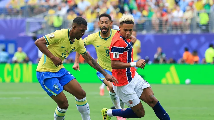 EAST RUTHERFORD, NEW JERSEY - JULY 05: Rayan #26 of Brazil competes for the ball against Antonio Nusa #20 of Norway during the FIFA World Cup 2026 Round of 16 match between Brazil and Norway at New York New Jersey Stadium on July 05, 2026 in East Rutherford, New Jersey. (Photo by Elsa/Getty Images)
