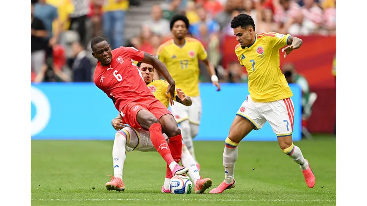 VANCOUVER, CANADA - JULY 07: Denis Zakaria #6 of Switzerland competes for the ball against Gustavo Puerta #14 and Luis Diaz #7 of Colombia during the FIFA World Cup 2026 Round of 16 match between Switzerland and Colombia at BC Place Vancouver on July 07, 2026 in Vancouver, British Columbia, Canada. (Photo by David Ramos/Getty Images)