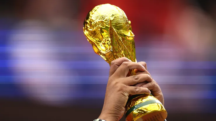 HOUSTON, TEXAS - JULY 04: A fan holds a replica of the FIFA World Cup Trophy before the FIFA World Cup 2026 Round of 16 match between Canada and Morocco at Houston Stadium on July 04, 2026 in Houston, Texas. (Photo by Molly Darlington/Getty Images)